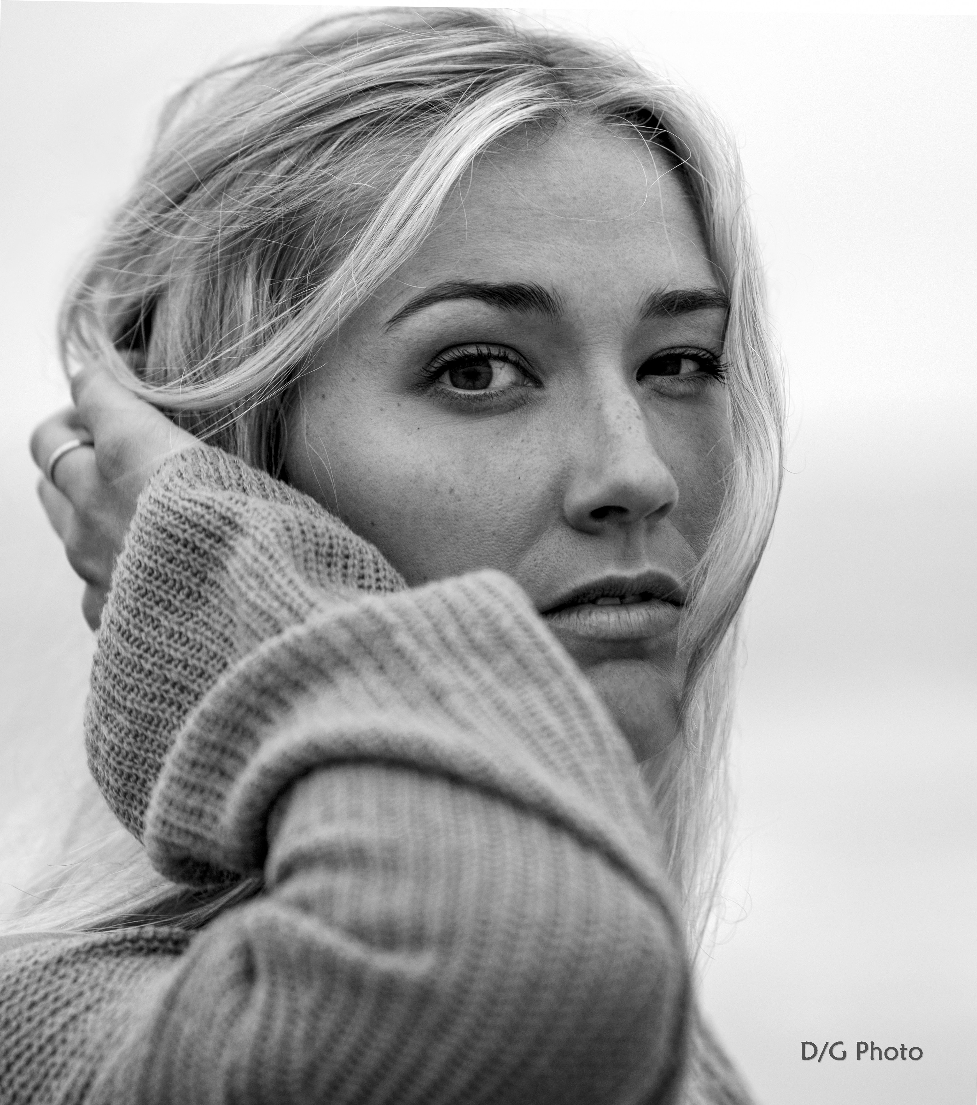 Woman in dark blazer looking back portrait
