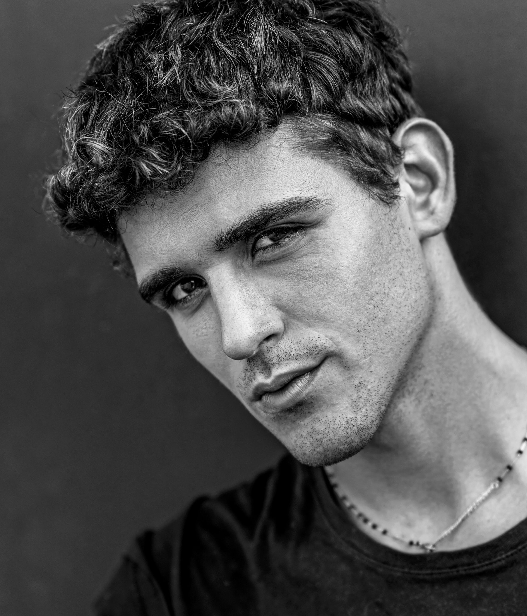 Man with curly hair portrait headshot